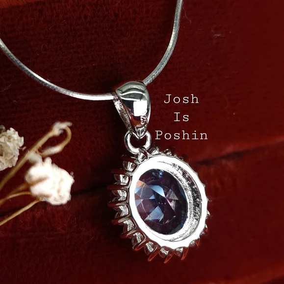 Oval blue topaz pendant necklace in sterling silver